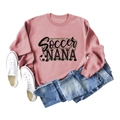 Flat lay of pink Soccer Nana sweatshirt with sneakers and denim shorts for casual style - S / Rose Gold