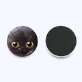 Detailed view of circular glass fridge magnets featuring cute big-eyed cat illustrations - Black Cat Yellow Eyes (JY007919-6)