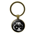 Close-up of bronze cat keychain pendant with gothic feline art and glass cabochon - Gothic Makeup Cat Face Style (JY007899-9)