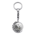 Macro detail of the rotating silver metal pendant with an owl sketch and yellow eyes - Owl Style(JY007930-23)