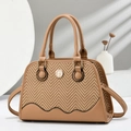 Minimalist beige shell crossbody bag featuring herringbone weave and brown leather trim - Earthy Yellow