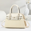 Detail of elegant beige herringbone handbag with golden bow hardware and leather trim - Off White