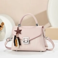 Elegant light pink crossbody bag with metal buckle and star tassel on geometric stand - Blue