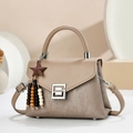 Minimalist beige crossbody handbag with textured finish and elegant star charm pendant - Khaki