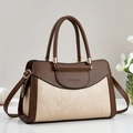 Detailed macro view of two-tone brown tote bag featuring fine vertical silk textures - Khaki