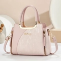 Elegant light pink women's handbag with gold hardware and stylish patchwork design - Pink