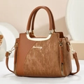 Elegant brown faux leather tote bag with vertical stripes and golden metal handles - Earthy Yellow