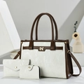 Three-piece beige and brown tote bag set with golden bow hardware on geometric blocks - White