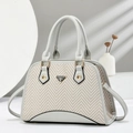 Elegant shell-shaped grey and beige patchwork handbag with gold metal logo and top handles - Gray