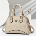 Detail of beige shell handbag showing textured herringbone weave and metal logo plate - Khaki