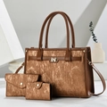Detailed view of 3-piece vintage brown tote set with pleated texture and bow buckle - Earthy Yellow
