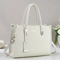 Detailed side view of cream leather tote bag with silver hardware and adjustable strap - Off White