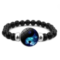 Macro detail of elastic beaded bracelet with galaxy yin yang charm and silver spacers - Starry Sky Tai Chi Cosmos (JY007992-12)