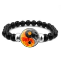 Macro detail of black beaded bracelet with orange and grey yin yang celestial charm - Sun and Moon Yin Yang Design (JY007992-10)