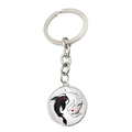 Macro shot of Yin Yang koi fish keychain with polished silver metal finish and glass dome - Black And White Koi Embrace Yin Yang Style (JY007999-8)