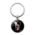 Close-up of letter V floral charm keychain with polished glass dome and gold metal ring - Letter V (JY008011-V)