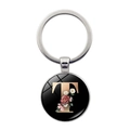 Detail of silver keychain with glass cabochon featuring pink floral letter T on black background - Letter T (JY008011-T)