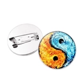 Detailed view of the yin-yang dragon glass cabochon pin with its silver metal backing - Ice and Fire Elements Tai Chi Style (Silver)