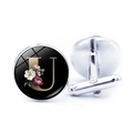 Detailed view of silver cufflink with golden letter U and floral patterns on black background - Jy008019-u / Other