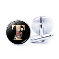 Close-up of circular shirt cufflink featuring gold letter T and floral design - Letter T (JY008019-T)