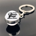 Macro view of silver glass dome keychain with Super Papa text and clear reflection - Super Papa valide par mon fils French Design (XSWX2255-14)