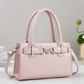 Detailed view of pink leather handbag featuring silver DOC metal buckle and top handles - Pink