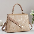 Detail of champagne gold handbag showing vertical pleated texture and metallic finish - Khaki