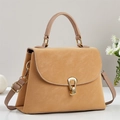Close-up of light brown leather handbag featuring lychee texture and golden horseshoe buckle - Khaki