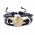 Detail view of woven leather bracelet with Keep Calm and Carry On crown quote charm - Crown WRITE ON (JY008098-6)