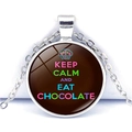 Macro shot of glass cabochon pendant with Keep Calm and Eat Chocolate quote - Dark Chocolate Cupcake Style (JY008111-9)