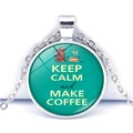 Macro shot of silver pendant with Keep Calm and Make Coffee slogan on teal background - Cyan Coffee Pot Style (JY008111-8)