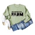 Detail of sage green sweatshirt with Life Is Better On The Farm text and icons - Olive Green Sweatshirt (Black Text Pattern)