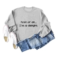 Flat lay of gray crewneck sweatshirt featuring First of all printed slogan with denim shorts - S / Grey Sweatshirt (Black Font)