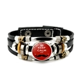 Detail view of multilayer braided leather bracelet with Keep Calm quote and metal charms - Mustache Style (JY008105-7)
