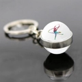 Macro detail of rhythmic gymnastics crystal ball keychain with dancer silhouette and reflection - Long Ribbon Silhouette Style (JY008149-10)