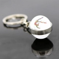 Macro detail of rhythmic gymnastics glass sphere keychain with colorful athlete silhouette - Dotted Silhouette Style (JY008149-9)