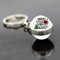 Detail of Christmas glass ball keychain with festive hot cocoa and tree graphic - Hot Cocoa and Movies (JY008175-8)