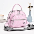 Pink marbled texture handbag with multiple zipper pockets and wide patterned strap - Light Pink