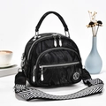 Black marble-textured crossbody bag with multi-zipper design and wide pattern strap - Black