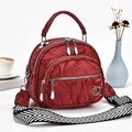 Detail of dark red marble pattern handbag with multi-layer zippers and woven strap - Burgundy