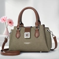 Detail of elegant khaki canvas tote with brown leather handles and silver metal buckle - Green