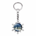 Close-up of snowflake keychain featuring a winter village scene with snowy houses and trees - Snowy Night Church (JY008220-12)