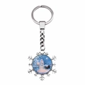 Macro shot of silver snowflake keychain featuring a vintage winter house glass dome - Jy008220-10