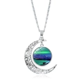 Detail of silver hollow moon pendant featuring aurora borealis glass stone and mountain scene - Green Aurora Snow Mountain Lake (JY008214-9)