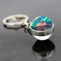 Macro detail of aurora borealis glass ball keychain showing snowy mountain landscape - Aurora Reflecting Snow Mountain Style (JY008212-10)