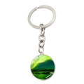 Close-up of circular silver keychain with bright green aurora borealis landscape glass dome - Aurora Night Lake (JY008215-12)