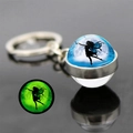 Glow-in-the-dark butterfly fairy keychain showing green luminous effect in dark - Blue Moon Night Black Fairy Silhouette Style (JY008269-11)