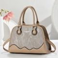 Elegant beige paneled tote bag with textured silver finish and wave-shaped trim details - Khaki