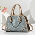 Fashionable grey-blue textured handbag with light brown trim and silver metal chain strap - Gray