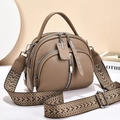 Detail of khaki leather handbag with triple zippers and woven vintage shoulder strap - Dark Khaki